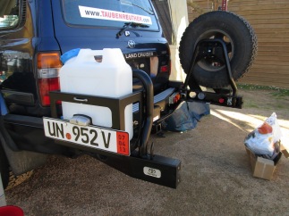 ARB rear bumper system. Steel with jerry can holder and spare tire mounts that swing away from the back of the truck